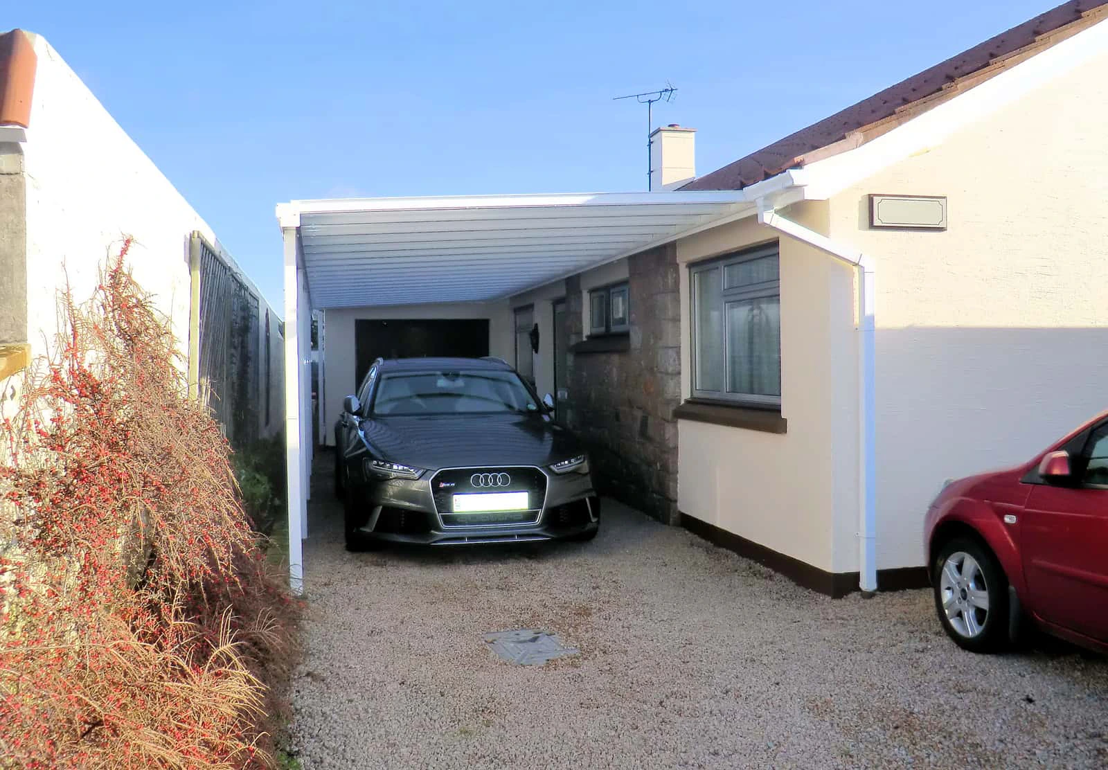 Harbour aluminium carport covering a side-passage driveway
