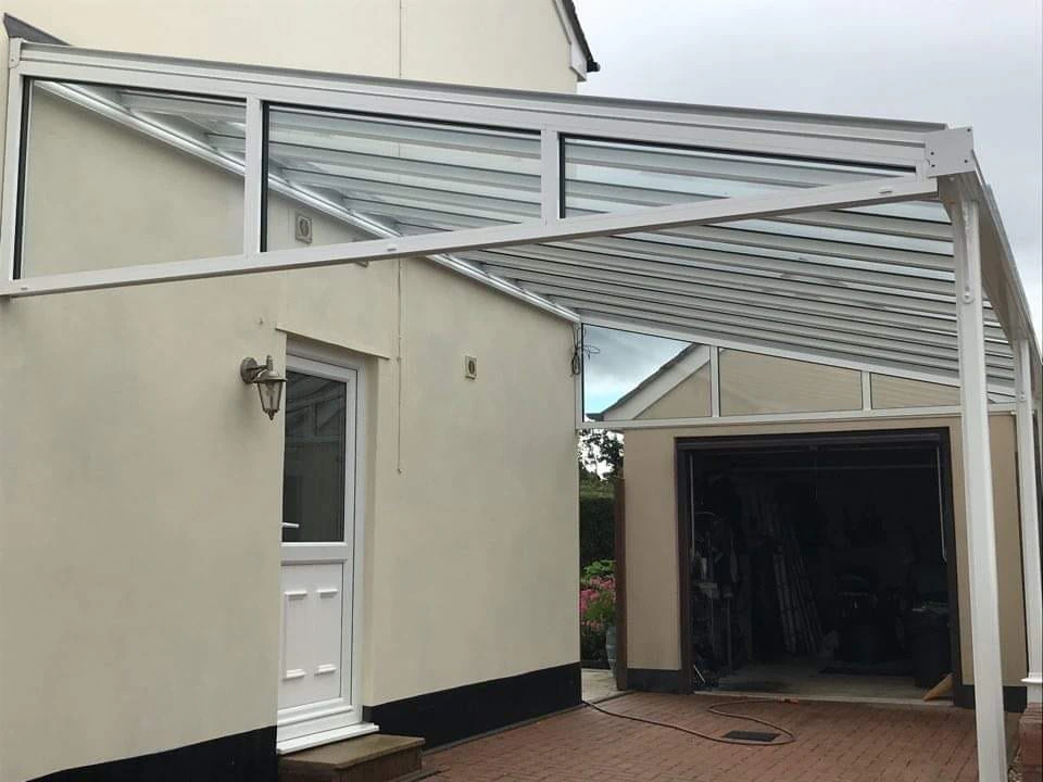 Harbour aluminium carport in anthracite grey on a brick-paved drive