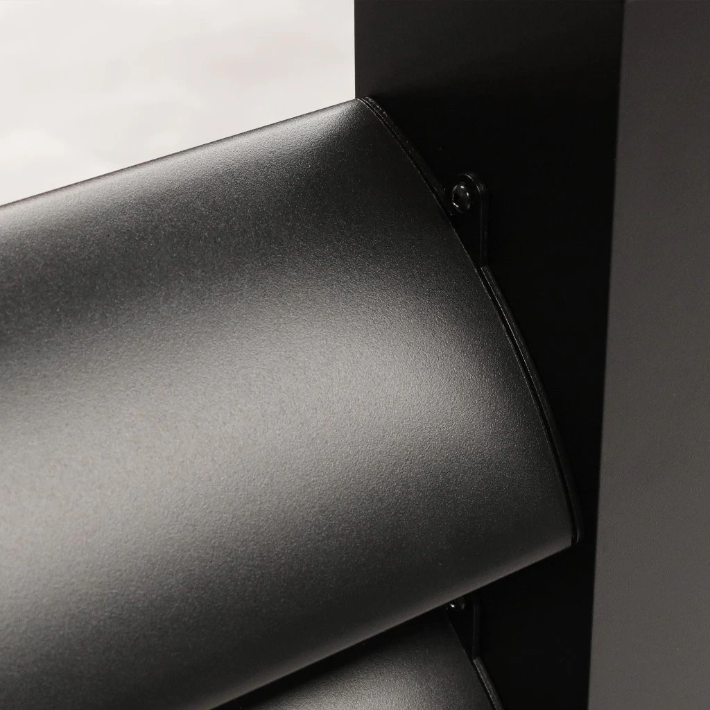 Close-up of a single anthracite aluminium louvred wall blade showing the rounded aerofoil profile