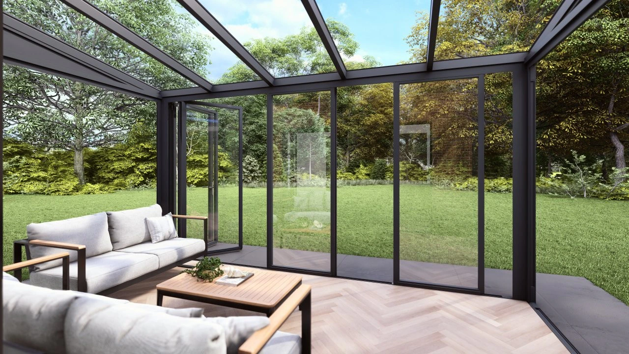 Interior of a slide and tilt glass room with sofa and coffee table on herringbone parquet flooring facing a lawn