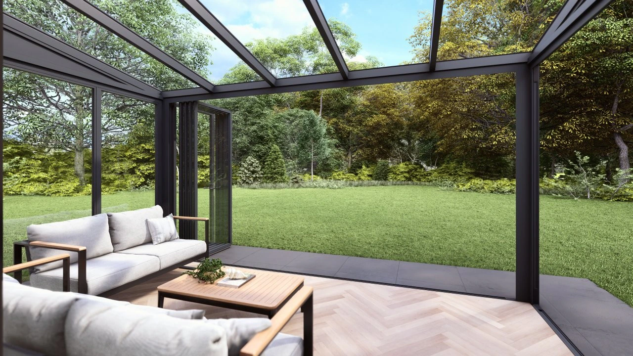 Slide and tilt glass room interior with white corner sofa looking out over a manicured lawn and trees